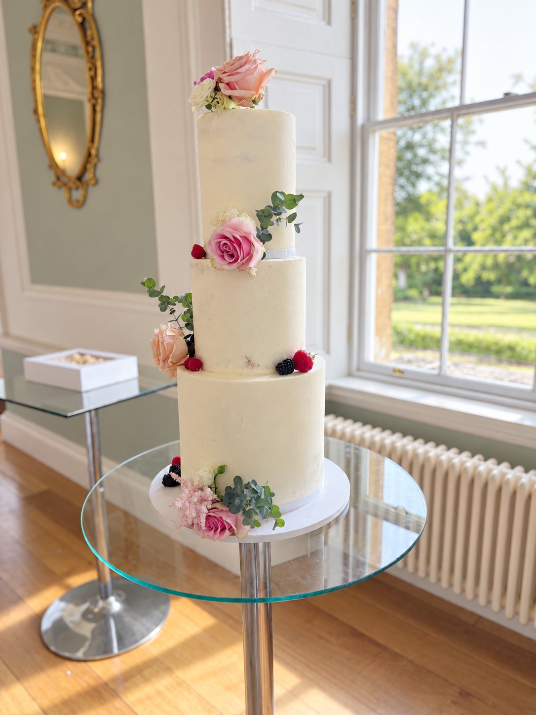 Three-tier semi-naked wedding cake by Thistleberry Cake Studio